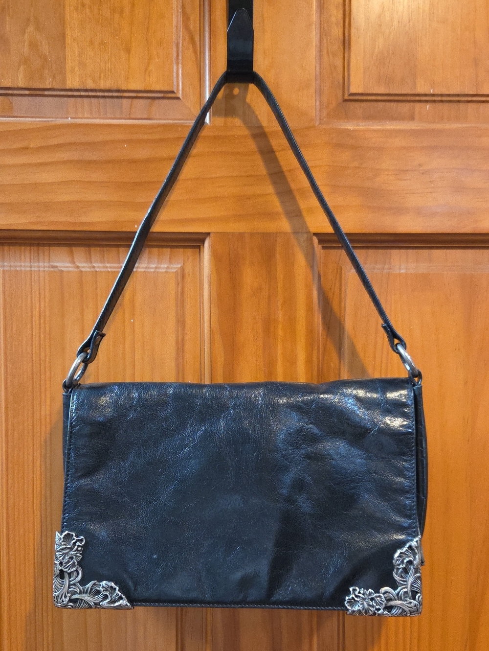 Black Leather Shoulder Bag with Silver Corner Accents